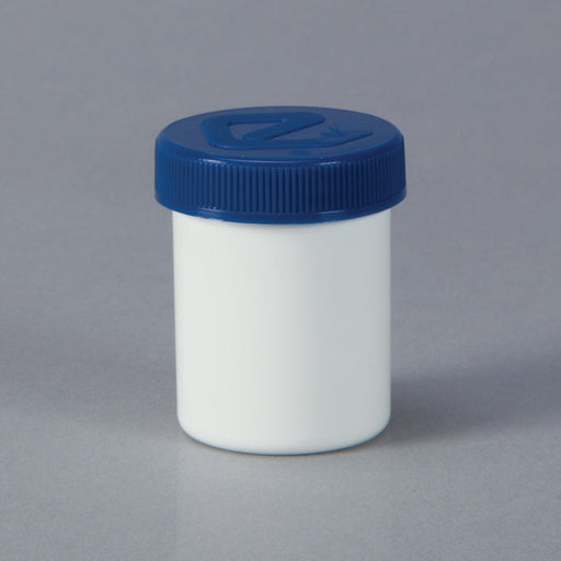 A white jar with a blue lid sits on a gray surface.