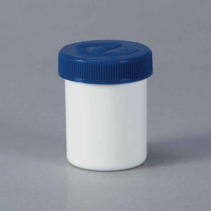 A white jar with a blue lid sits on a gray surface.
