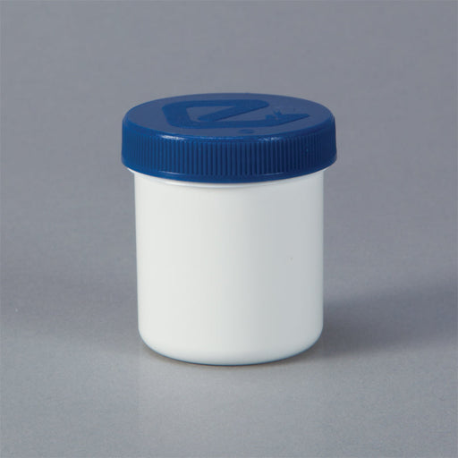 A white jar with a blue lid sits on a gray surface.