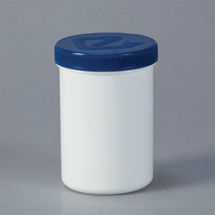 A white cylindrical jar with a dark-blue lid sits on a plain gray background.