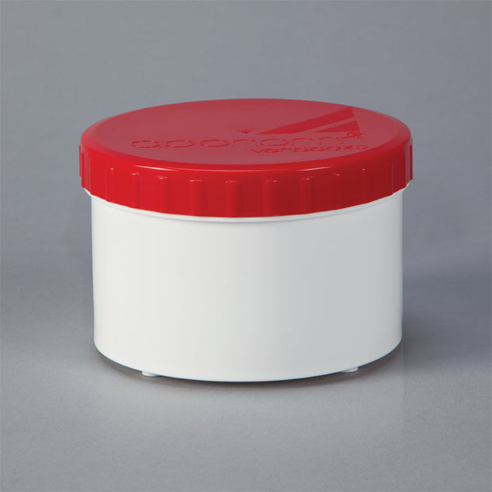 A short, cylindrical white container sits on a gray background; it has a bright red lid.