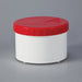 A short, cylindrical white container sits on a gray background; it has a bright red lid.