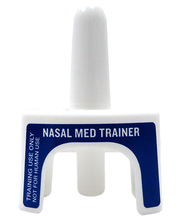A white plastic nasal med trainer sits on a white background. The device is labeled "NASAL MED TRAINER" and "TRAINING USE ONLY NOT FOR HUMAN USE".
