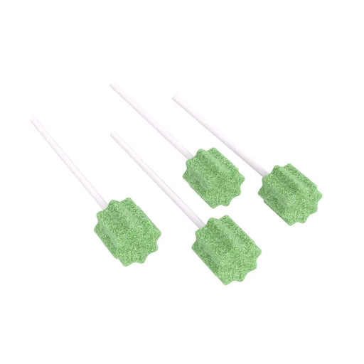 Four light-green bottle brushes with metallic handles are arranged closely together on a white background.
