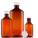 Three amber plastic bottles, of varying sizes, sit on a white background. The bottles are likely for medicine.