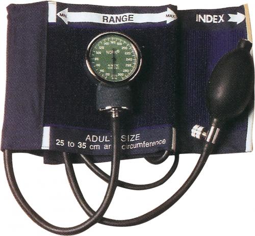 A black sphygmomanometer rests on a surface. Its gauge displays blood pressure readings; attached are an inflatable cuff and connecting tubes.