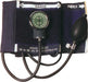 A black sphygmomanometer rests on a surface. Its gauge displays blood pressure readings; attached are an inflatable cuff and connecting tubes.