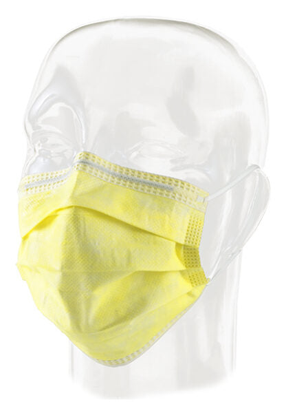 A pale yellow surgical mask rests on a clear plastic mannequin head.