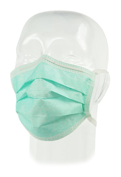 A light-green pleated surgical mask is worn on a transparent mannequin head, against a white background.