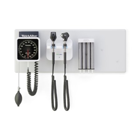 A medical wall-mounted unit displays a sphygmomanometer, otoscope, ophthalmoscope, and a storage compartment. The equipment hangs from the unit against a white background.