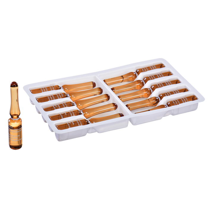 Amber glass ampoules, arranged in a plastic tray, likely for pharmaceutical or cosmetic use.