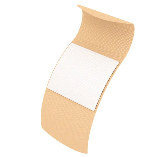 A beige adhesive bandage, folded slightly, rests on a plain white background. The bandage has a central, off-white absorbent pad.