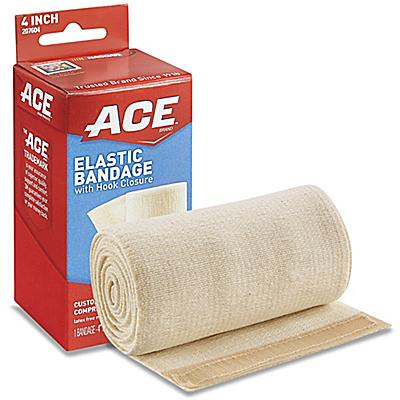 An ACE brand elastic bandage, with hook closure, rests on a surface near its packaging.