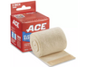 A beige elastic bandage, rolled out, with a hook-and-loop closure, rests beside its ACE brand packaging.