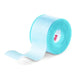 A roll of light-blue, translucent tape unwinds slightly, lying on a white surface.