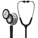 A Littmann stethoscope rests on a white background; its chest piece and tubing are silver and black.
