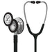A Littmann stethoscope, a medical instrument used for auscultation, rests on a white background.