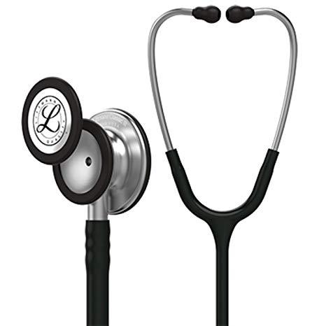 A Littmann stethoscope, with black tubing and silver chestpiece, rests on a white background.