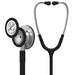 A Littmann stethoscope, with silver chestpiece and black tubing, lies on a white background.