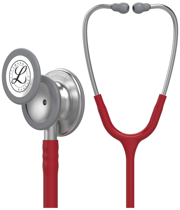 A Littmann Classic III stethoscope, shown in two views, features a red tubing and gray chestpiece. "Littmann Classic III Made in U.S.A." is engraved on the chestpiece.