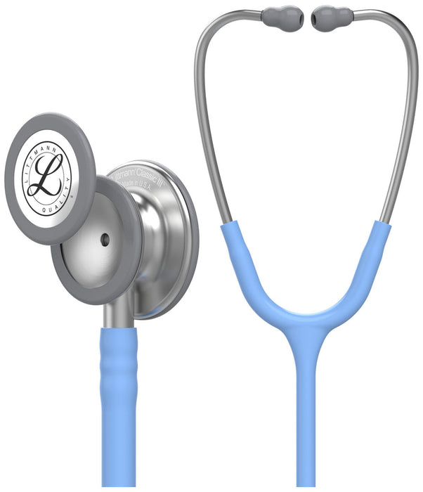 A Littmann Classic III stethoscope, light blue, displays its components and tubing against a white background. "Littmann Classic III Made in U.S.A." is engraved on the chest piece.