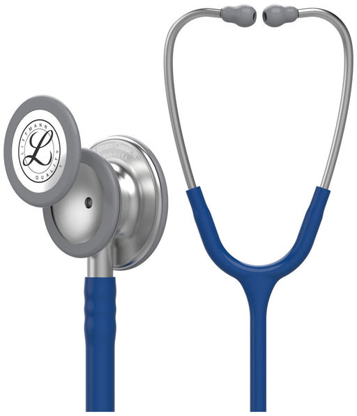A Littmann Classic III stethoscope, with a blue tubing and grey chest piece, is shown in a display against a white background. The chest piece is labeled "Littmann Classic III Made in U.S.A."