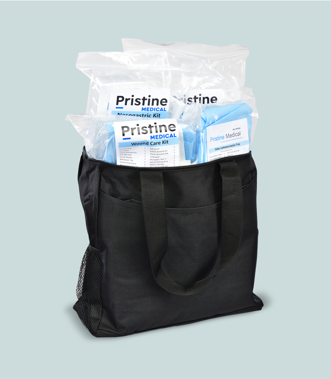 A black tote bag contains three Pristine Medical kits: a nasogastric kit, a wound care kit, and a Foley catheterization tray. The kits are in clear plastic packaging.