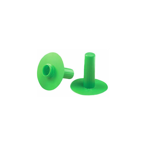 Two bright green plastic plugs sit on a white background; one is upright, the other lies on its side.