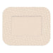 A beige adhesive bandage, featuring a lighter beige central area and a dotted border, sits on a white background.