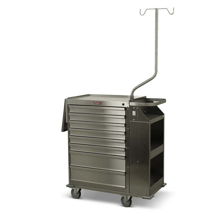 A stainless steel medical cart, with drawers and an IV pole, stands on wheels in a sterile environment.