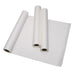 Three rolls of white paper lie on a flat sheet of the same paper. The rolls are partially unrolled, showcasing the material's texture.