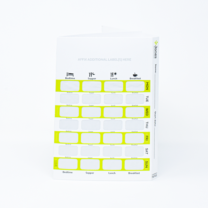 A weekly pill organizer displays daily compartments for bedtime, supper, lunch, and breakfast medications. It's a white card with green dividers and space to write. Start date is to be filled in.