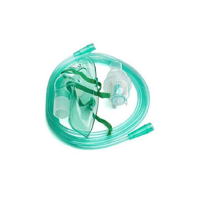 A light-green nebulizer mask and tubing lie coiled on a white surface.