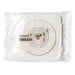 A SecuriT 7305234 medical adhesive disc with measurement markings is packaged in a clear plastic sleeve.