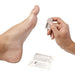 A hand applies a small, clear applicator to a bare foot; both are positioned against a white background near a transparent package containing more applicators.