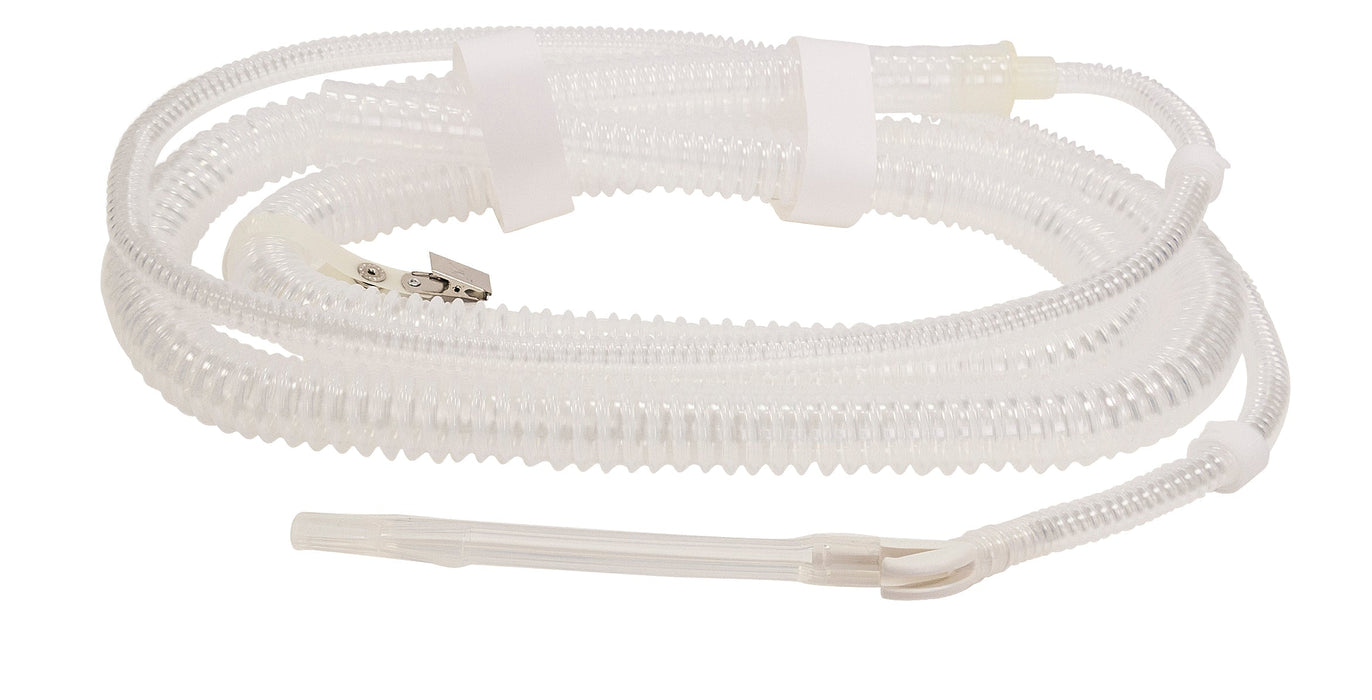 A corrugated, transparent medical tubing lies coiled on a white background; a smaller tube extends from it.