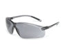 Gray safety glasses rest on a white background. They are positioned at a slight angle.
