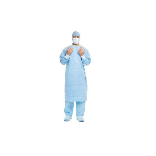 A medical professional in light blue scrubs and mask holds their hands near their chest, standing in a white space.