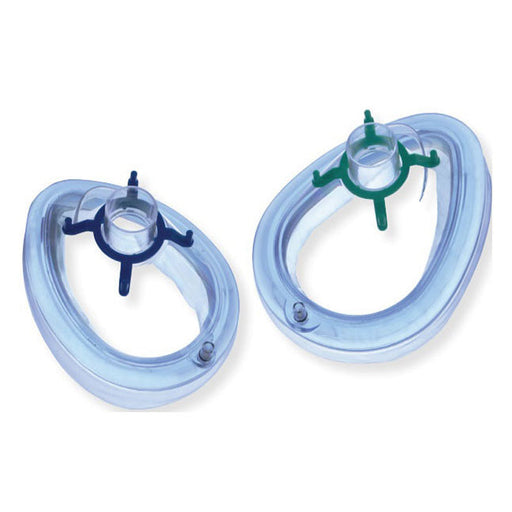 Two translucent, oval-shaped oxygen masks with central connectors and securing arms rest on a white surface.