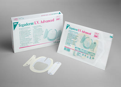 A Tegaderm I.V. Advanced transparent dressing lies open near its sealed package and a box of the same product.