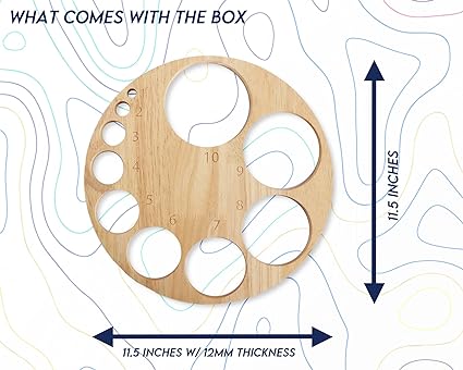 A circular wooden disc, featuring various sized holes numbered 1-10, is displayed against an abstract background. It measures 11.5 inches in diameter and is 12mm thick. "WHAT COMES WITH THE BOX" is written at the top.