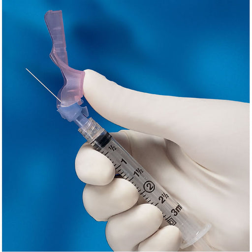 A gloved hand holds a syringe with a safety needle shield. The shield is being manipulated. The background is a solid blue.