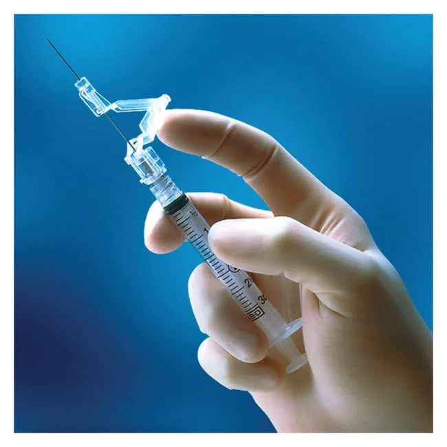 A gloved hand holds a syringe, preparing to inject, against a blurred blue background.