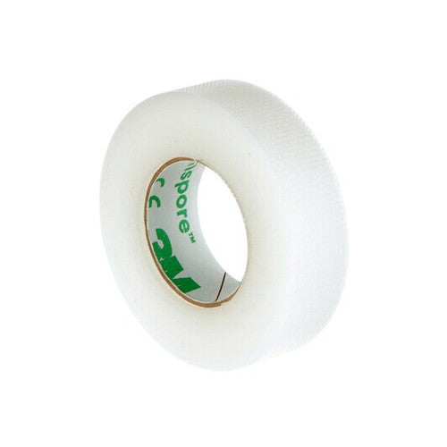 A roll of transparent tape sits on a plain white background. The tape's inner core is green.