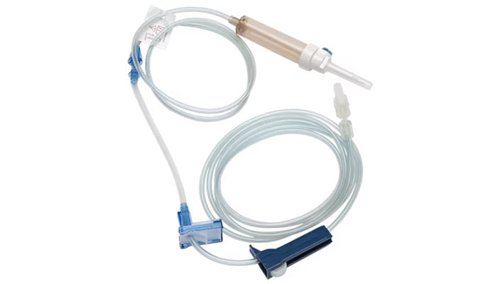 A medical intravenous (IV) set, coiled, lies on a white background. It includes tubing, a drip chamber, and connectors.