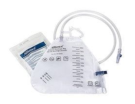 A sterile urine collection bag, with attached tubing and a separate packet, sits on a plain white background. The bag is graduated to measure urine volume.