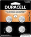Four Duracell CR2032 batteries are displayed on a package; they are child-safe and bitter-coated; compatible with Apple AirTags.