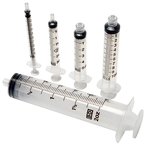 Several syringes of varying sizes are arranged on a dark background. They are made of clear plastic with black markings. The largest syringe is labeled "BD 2oz".