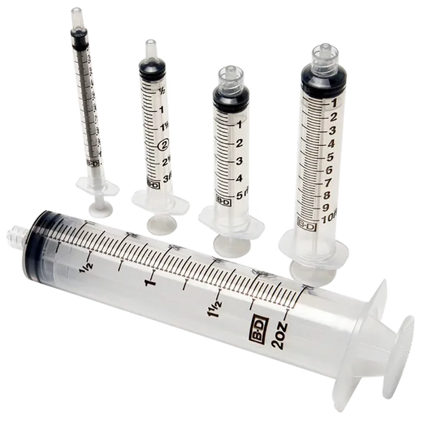 Several syringes of varying sizes are arranged on a dark background. They are made of clear plastic with black markings. The largest syringe is labeled "BD 2oz".