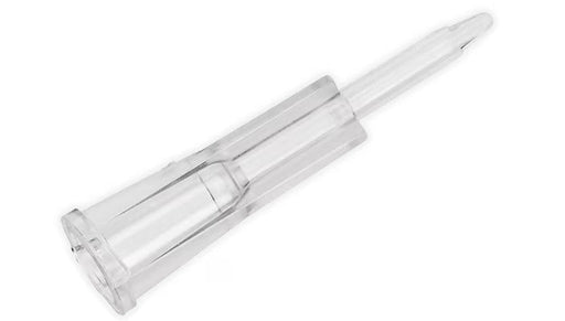 A clear plastic cannula extends; its pointed end is directed upward against a white background.